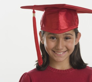 Hispanic girl wearing graduation cap