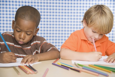 Two young boys coloring