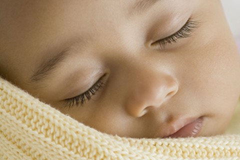 Close up of Hispanic baby sleeping