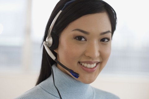 Asian businesswoman wearing headset