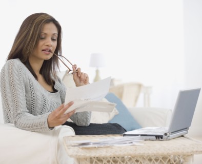 Indian woman paying bills