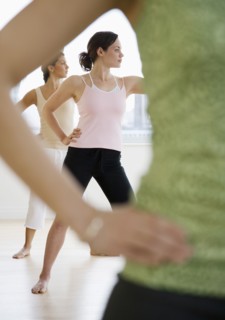 Three young women in yoga class