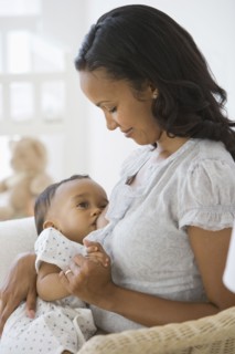 African American mother breastfeeding baby