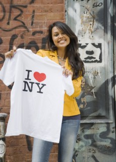 Mixed Race woman holding t-shirt