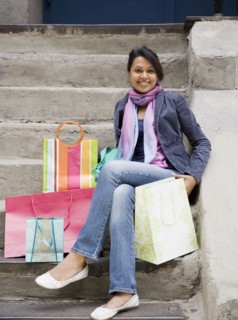 Mixed Race woman with shopping bags