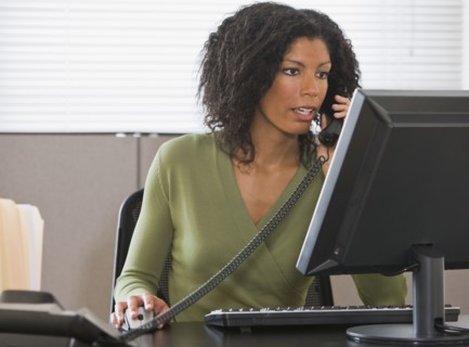 African businesswoman talking on telephone