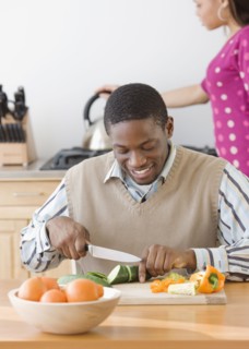 African man chopping vegetables