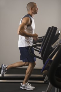Hispanic man running on treadmill