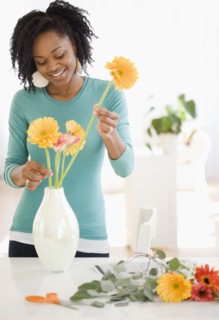 African woman arranging flowers