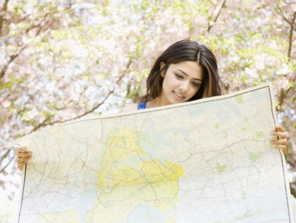 Middle Eastern woman holding map