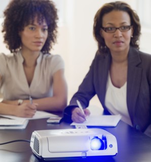 African business people watching slideshow
