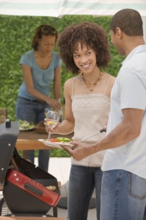 African man and women barbecuing