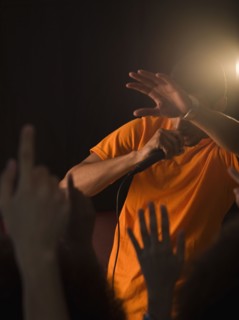 African man singing to audience
