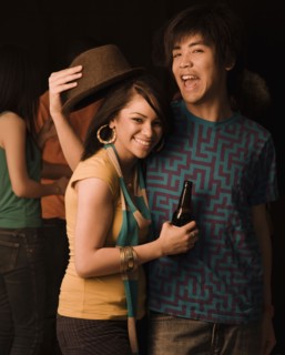 Multi-ethnic couple drinking in nightclub