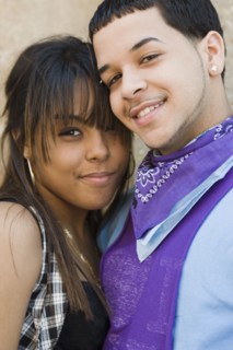 Hispanic couple hugging