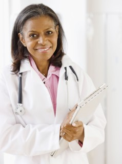 African doctor standing with medical chart