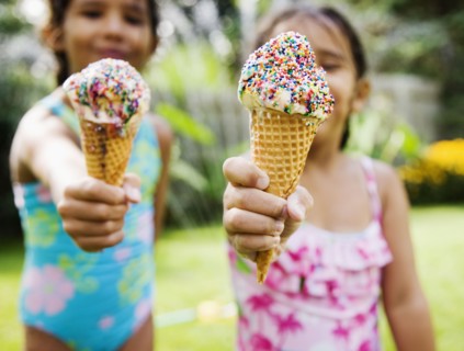 Hispanic girls eating ice cream cones