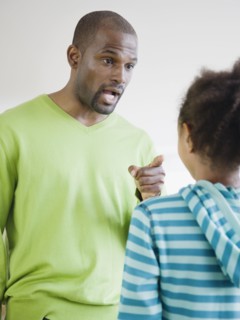 African father scolding daughter