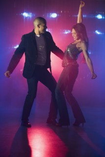 Boyfriend and girlfriend dancing at nightclub