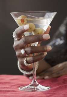 African woman drinking martini