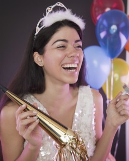 Hispanic woman at New Year's Eve party