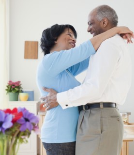 African couple hugging