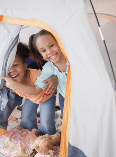 African girls playing in tent