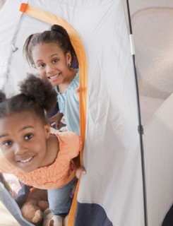African girls playing in tent