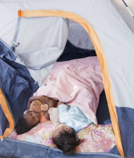 African girls sleeping in tent