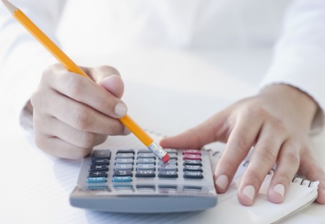 Woman using calculator