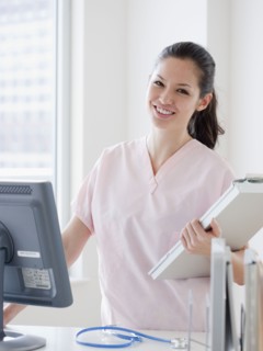 Mixed race nurse at nursing station