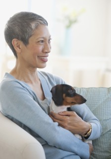Chinese woman holding dachshund