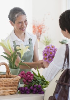 Chinese florist giving flowers to customer