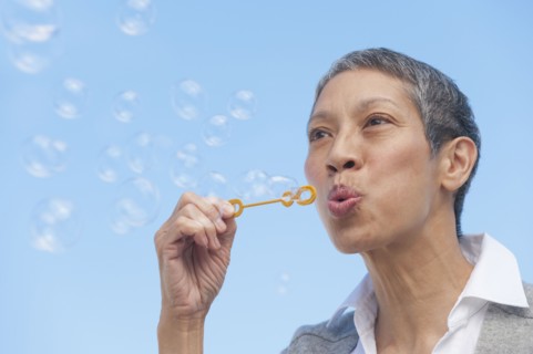 Chinese woman blowing bubbles