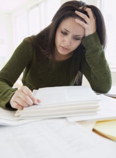 Mixed race woman frustrated over paperwork