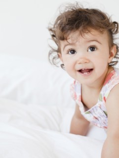Hispanic baby girl crawling