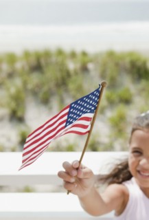 Hispanic girl holding American flag