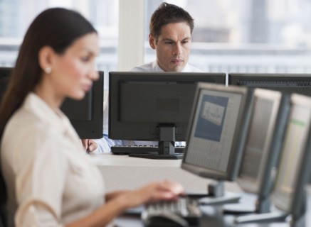 Hispanic businessman working on computer