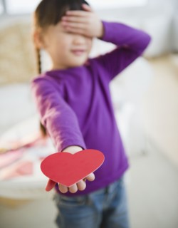 Chinese girl holding out Valentine