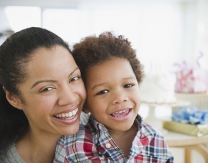 Mixed race mother smiling with son