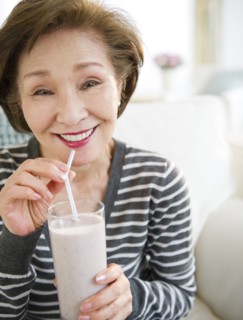 Japanese woman drinking smoothie