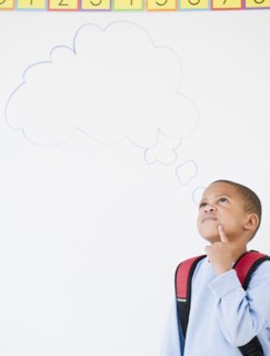 African American boy in school with thought bubble