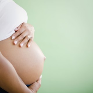 Close up of pregnant Black woman's stomach
