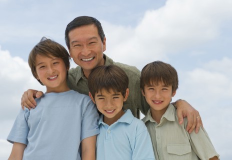 Smiling father and sons