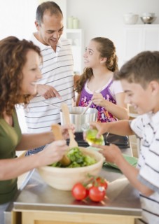 Hispanic family preparing dinner together