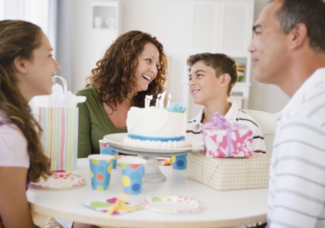 Hispanic family celebrating son's birthday