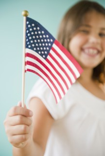 Hispanic girl holding American flag
