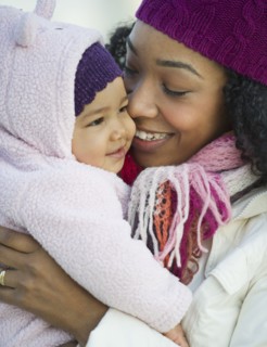 Mixed race woman holding baby