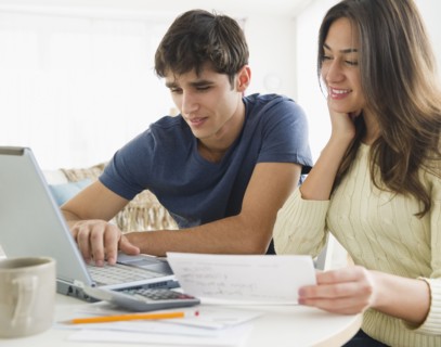 Couple paying bills together online
