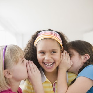 Girls whispering together
